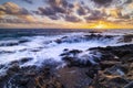Sunset at El Bufadero natural blowhole on Gran Canaria. Ocean waves hiting rocks Royalty Free Stock Photo