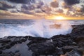 Sunset at El Bufadero natural blowhole on Gran Canaria. Ocean waves hiting rocks