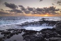 Sunset at El Bufadero natural blowhole on Gran Canaria. Ocean waves hiting rocks