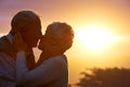 Sunset, elderly couple or kiss outdoor, care or bonding together for connection in marriage. Man, woman or nose touch Royalty Free Stock Photo