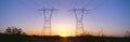 Sunset on electrical transmission towers Royalty Free Stock Photo