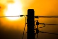Sunset and Eletricity line and electricity post