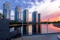 Sunset on the embankment in Kyiv. Poznyaki Park near the River Mall