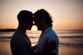 Sunset, embrace and gay men on beach, silhouette and love on summer vacation together in Thailand. Sunshine, ocean and Royalty Free Stock Photo