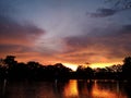 Sunset evening behind shadow black tree refect lake Royalty Free Stock Photo