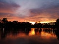 Sunset evening behind shadow black tree refect lake Royalty Free Stock Photo