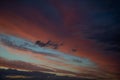 Sunset evening light blue sky with pink purple wispy clouds, high cirrocumulus a Royalty Free Stock Photo