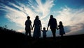 Sunset during a family walk through the fields. Happy family at sunset. Happy family concept. Royalty Free Stock Photo