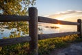 Sunset fence tree and lake