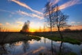 Sunset field with river Royalty Free Stock Photo
