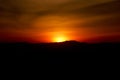 Sunset silhouette of western mountain