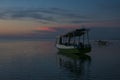 Sunset with fisher boat and still water on Gili Air Island, Indonesia