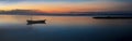 Sunset with fisher boat and still water on Gili Air Island, Indonesia Royalty Free Stock Photo