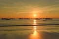 Sunset with fisher boats Ngwe Saung Beach Myanmar Royalty Free Stock Photo