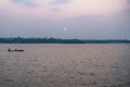 Sunset with fishing boat at the Ashtamudi Lake, Kollam, Kerala, India Royalty Free Stock Photo