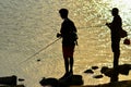 Sunset fishing silhouette Royalty Free Stock Photo