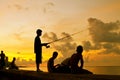 Sunset fishing. Silhouettes on HavanaÃÂ´s malecon