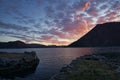 Sunset on the fjord of Selje Norway. very beautiful colors reflected in the clouds and the water Royalty Free Stock Photo