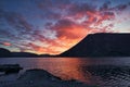 Sunset on the fjord of Selje Norway. very beautiful colors reflected in the clouds and the water Royalty Free Stock Photo