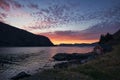 Sunset on the fjord of Selje Norway. very beautiful colors reflected in the clouds and the water Royalty Free Stock Photo