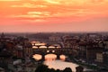 Sunset in Florence with a view of the Ponte Vecchio and the medieval city Royalty Free Stock Photo