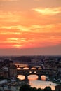 Sunset in Florence with a view of the Ponte Vecchio and the medieval city Royalty Free Stock Photo