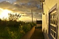 Sunset on Flores Island with a pretty house in the foreground Azores Portugal