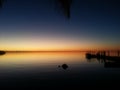 Sunset in the Florida Keys with Palm Tree and Dock Royalty Free Stock Photo