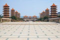 Sunset at Fo Guang Shan buddist temple of Kaohsiung, Taiwan with many tourists walking by Royalty Free Stock Photo