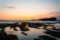 Sunset from Gadon beach with the rock formation near Tanah Lot Temple Royalty Free Stock Photo