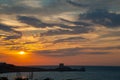 Sunset on the Gargano, trebuchet and Saracen tower Royalty Free Stock Photo