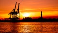 Sunset at Genoa`s port, silhouette of the Lanterna, Italy Royalty Free Stock Photo