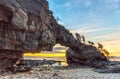 Sunset on giant stone gate