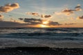 Sunset Glow Over Tumultuous Pacific Beach Royalty Free Stock Photo