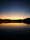 Sunset, golden hour mirrored in lake