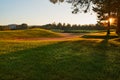 Sunset at the Golf Course - The sun sets on a putting green at the golf course in Autumn Royalty Free Stock Photo