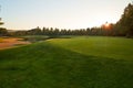 Sunset at the Golf Course - The sun sets on a putting green at the golf course in Autumn Royalty Free Stock Photo