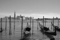 At sunset a Gondolas parking is a traditional, flat-bottomed Venetian rowing boat,