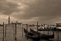 At sunset a Gondolas parking is a traditional, flat-bottomed Venetian rowing boat, Royalty Free Stock Photo