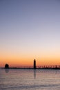 Sunset at the Grand Haven, Michigan, lighthouse and pier on Lake Michigan Royalty Free Stock Photo