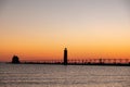 Sunset at the Grand Haven, Michigan, lighthouse and pier on Lake Michigan Royalty Free Stock Photo
