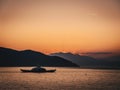 Sunset in Greece with ferry between two islands Royalty Free Stock Photo