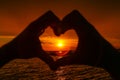 Sunset in heart hands Royalty Free Stock Photo