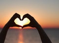 Sunset in heart hands without face Royalty Free Stock Photo