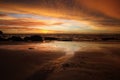 Sunset after heavy rain with arcus shelf storm clouds and stones in the ocean on tropical island Ko Lanta, Thailand Royalty Free Stock Photo