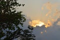Sunset hiding in the clouds Royalty Free Stock Photo