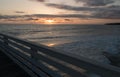Sunset highlights on white rail  of Crystal Pier, San Diego Royalty Free Stock Photo