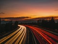 Sunset on highway with car lights Royalty Free Stock Photo