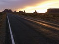 Sunset on highway in Monument Valley. Royalty Free Stock Photo