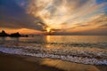 Sunset on the horizon and gentle waves Royalty Free Stock Photo